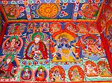 Manaslu 06 08 Syala Kani Painting The paintings on Syala�s kani wall include a 4-armed Avalokiteshvara on the left, then Padmasambhava, a six-armed Mahakala, and red Hayagriva on the right.